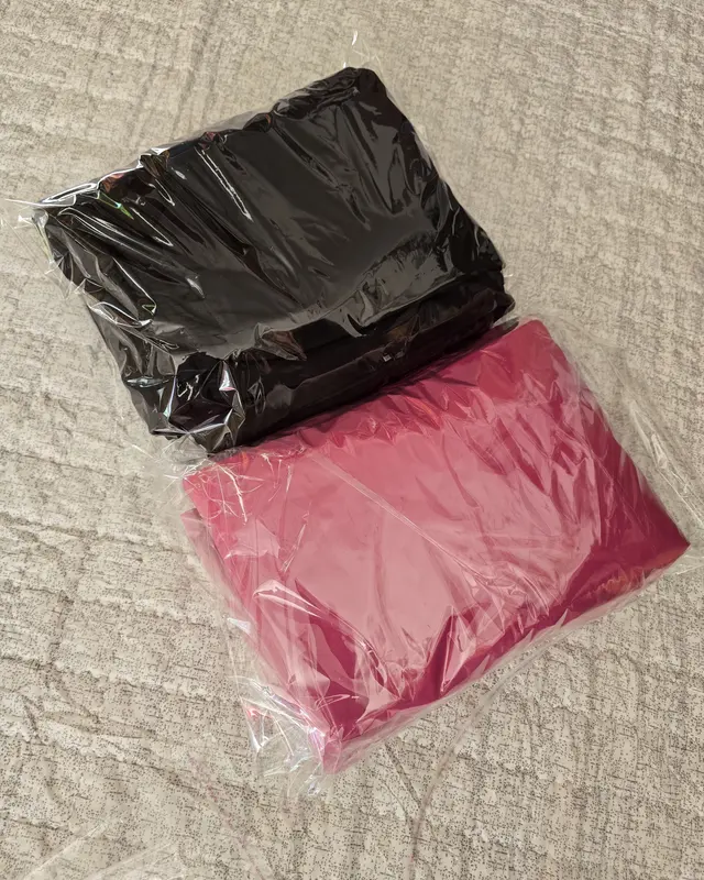Finished black and pink garments folded into polybags, ready to ship, Wears For You, Sialkot Pakistan