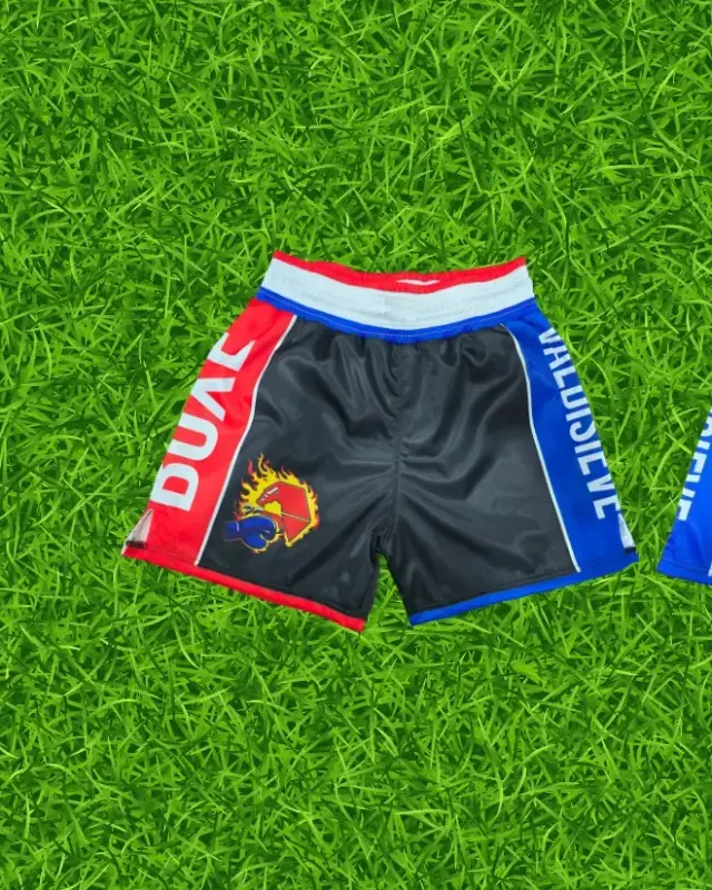 Sublimated boxing shorts on the factory turf backdrop, custom fight wear, Wears For You, Sialkot Pakistan