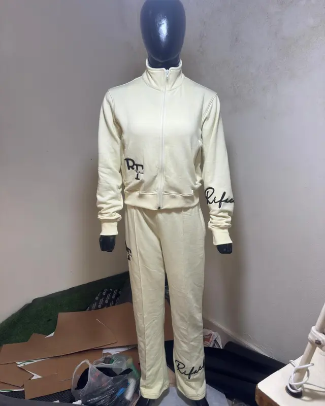 Cream embroidered tracksuit fitted on a mannequin, custom streetwear, Wears For You, Sialkot Pakistan