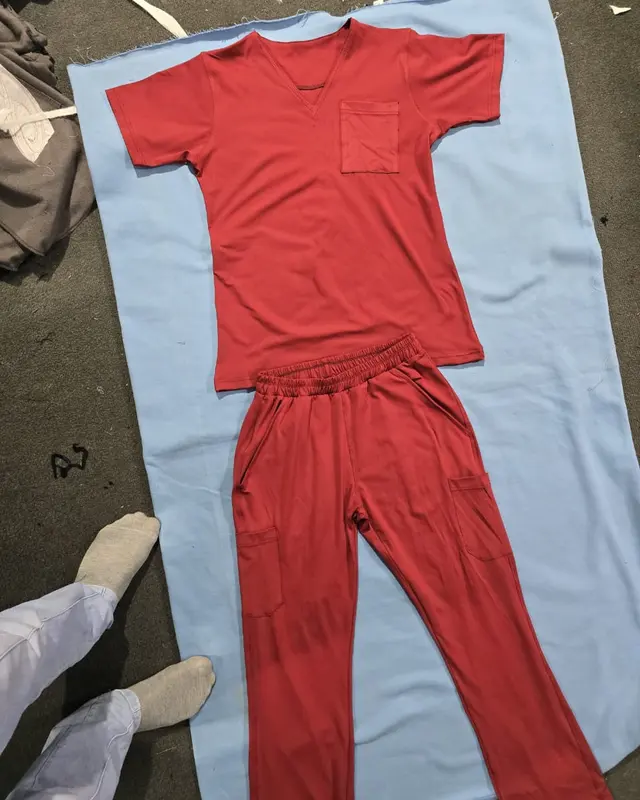 Red scrub top and trouser set laid flat, custom medical scrubs, Wears For You, Sialkot Pakistan
