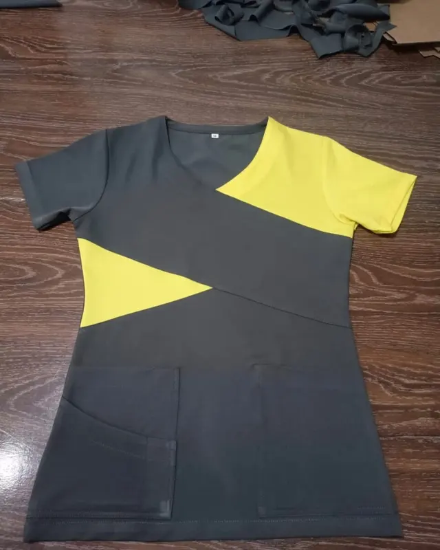 Charcoal scrub top with a yellow chevron panel, custom medical scrubs, Wears For You, Sialkot Pakistan