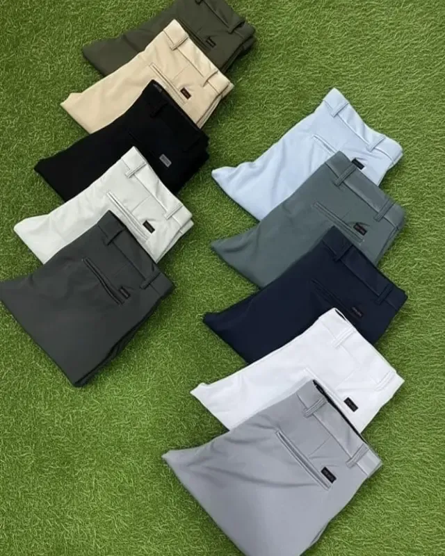 A full colourway range from one production run laid out on the factory floor, custom clothing manufacturer, Wears For You, Sialkot Pakistan