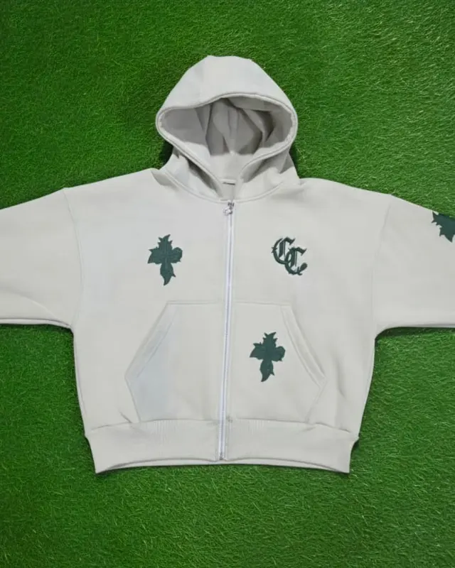 Cream hoodie with green cross prints on the factory turf backdrop, Wears For You, Sialkot Pakistan