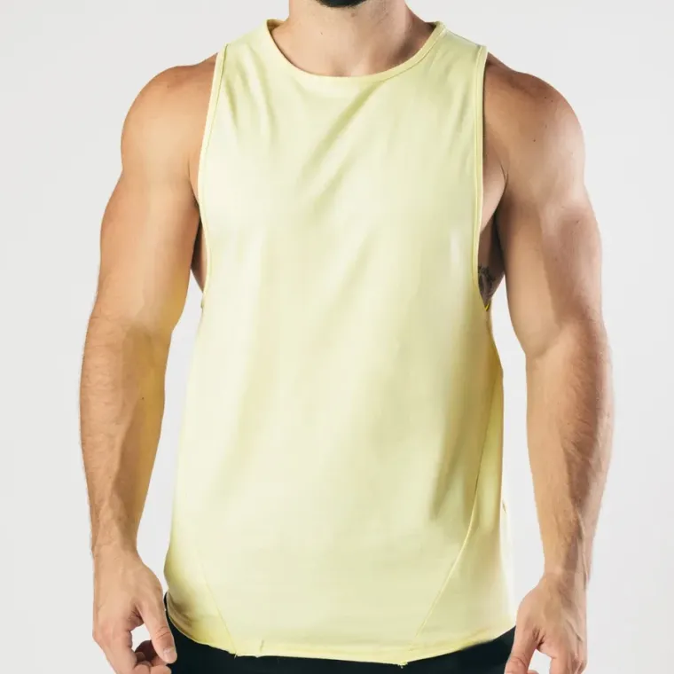 Pale yellow drop-arm gym tank front view, custom gym vest manufacturing, Wears For You, Sialkot Pakistan
