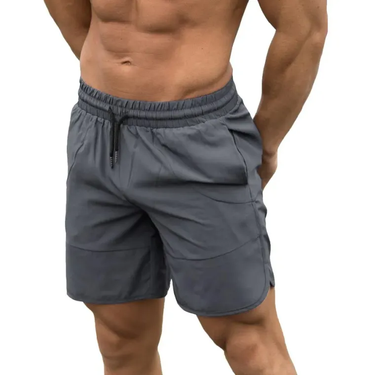 Charcoal training shorts with a mid-length inseam worn by a model, custom gym shorts manufacturing, Wears For You, Sialkot Pakistan