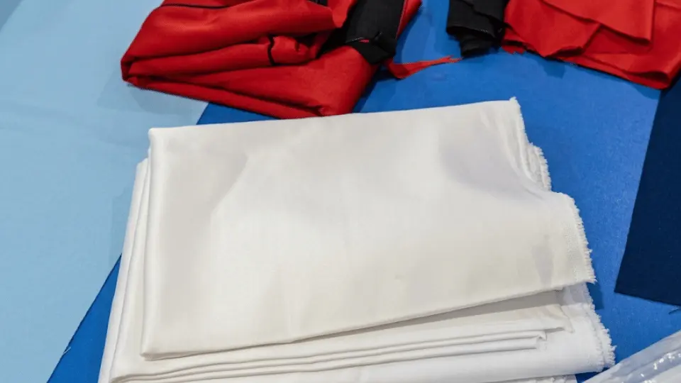 Satin fabric selection for boxing shorts, custom sportswear manufacturing, Wears For You, Sialkot Pakistan