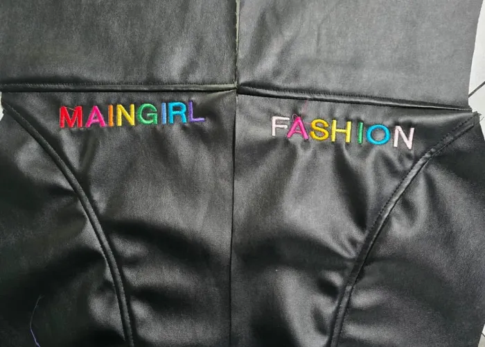 Custom faux leather jumpsuit front view, women's fashion brand manufacturing, Wears For You, Sialkot Pakistan