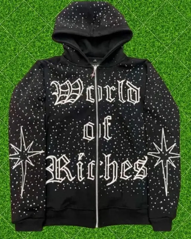 Black World of Riches rhinestone zip hoodie on the factory turf backdrop, Wears For You, Sialkot Pakistan