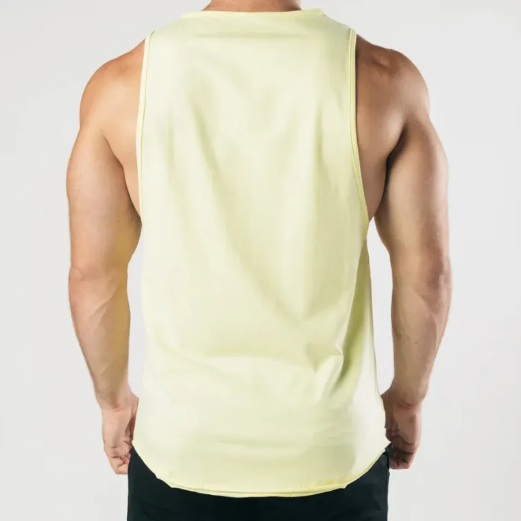 Pale yellow drop-arm gym tank back view showing the armhole depth, custom gym vest manufacturing, Wears For You, Sialkot Pakistan