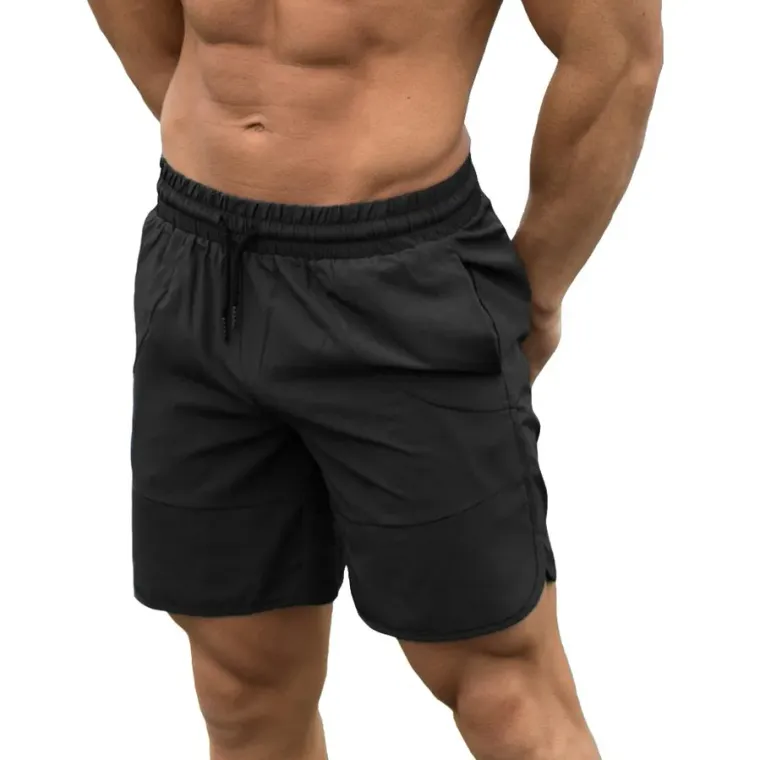 Black gym shorts with side pockets worn by a model, custom gym shorts manufacturing, Wears For You, Sialkot Pakistan
