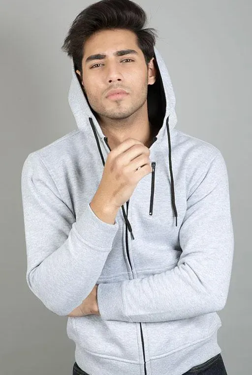 Heather grey zip-up hoodie worn by a model, custom hoodie manufacturing, Wears For You, Sialkot Pakistan