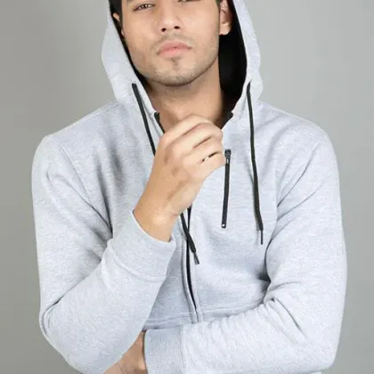 Heather grey zip-up hoodie worn by a model, custom hoodie manufacturing, Wears For You, Sialkot Pakistan
