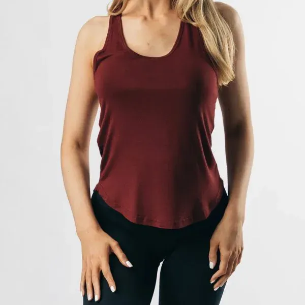Maroon women's gym tank top worn by a model, custom women's gym tank tops, Wears For You, Sialkot Pakistan