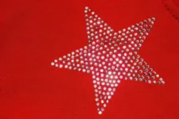 Rhinestone crystals applied in a star pattern on a red garment, rhinestone application, Wears For You, Sialkot Pakistan