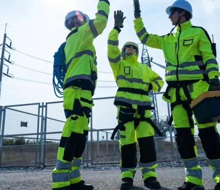 Team wearing custom high-visibility workwear jackets, workwear manufacturing, Wears For You, Sialkot Pakistan